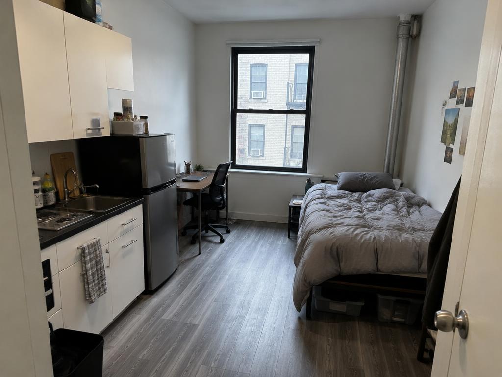 Illustrative Studio (0 BR) interior for the Bushwick budget example — not a real listing